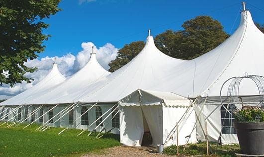 multiple portable restrooms for large-scale outdoor events, ensuring availability for all guests in Lansing